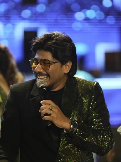 A candid shot of me interacting with the audience during a Sangeet. My style is to be approachable and engaging, making everyone feel part of the celebration.