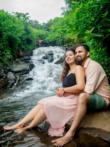 A quiet, romantic moment for the couple as they sit by the waterfall. These peaceful shots provide a beautiful contrast to the energy of the wedding day.