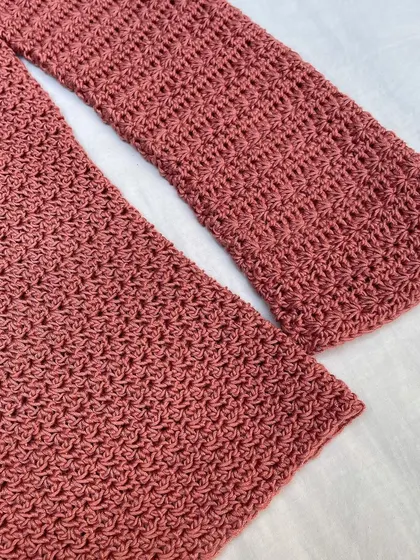 A close-up of the beautiful star stitch on the Etoile Sweater's sleeve. I put a lot of love into getting these details just right, ensuring every handmade piece is special and high-quality.