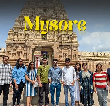 The Mysore day trip group in front of a stunning temple. We explore the city's rich heritage and beautiful architecture.