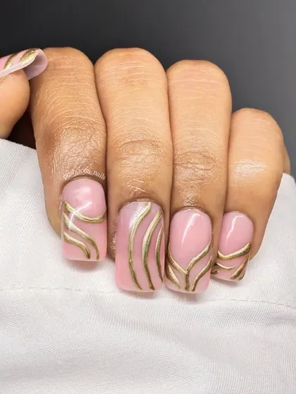 Metallic gold lines on a soft pink base. This design is simple, elegant, and so chic. The clean lines and geometric pattern give it a very modern feel.