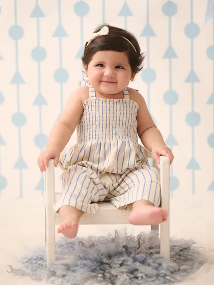 A simple and classic sitter portrait. Sometimes a cute outfit and a tiny chair are all that is needed to capture your baby's adorable personality.