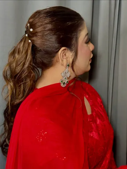 A view of the chic ponytail hairstyle with pearl accessories that I created to go with this soft glam makeup.