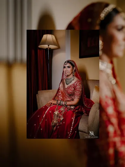An elegant portrait of the bride seated, looking like royalty.