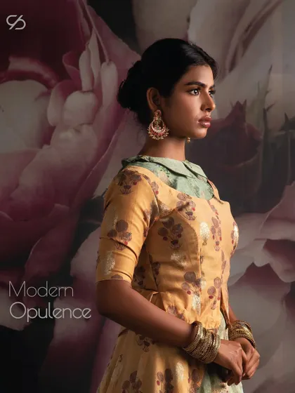 Timeless fashion, modern twist. This collared blouse paired with a tiered floral skirt offers a unique take on modern opulence for any festive event.