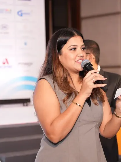 A candid shot of me interacting with someone on stage during the PPL Conclave.