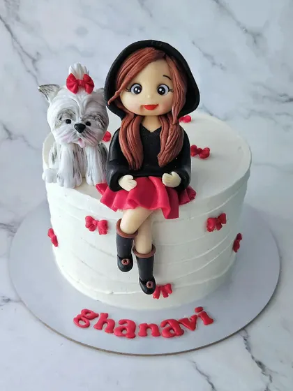 Dressed right for the Bengaluru weather! This butterscotch cake for Ghanavi features a stylish girl in a pullover and skirt with her adorable shih tzu.