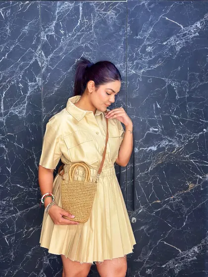 The lightweight fabric and relaxed fit of this shirt dress make it a comfortable and stylish choice.