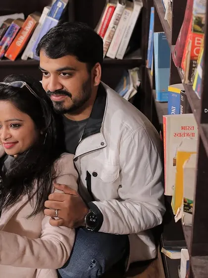 For couples who share a love for books, a library setting can be a unique pre-wedding shoot location. Here, they are sharing a story, which is a beautiful metaphor for the new chapter they are beginning together.