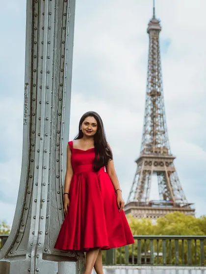 My client looking stunning in a classic red dress for her pre-wedding photoshoot in Paris.
