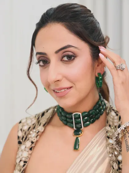 A different angle of the soft ponytail. This hairstyle is perfect for showcasing a statement necklace and earrings, keeping the hair away from the face in a stylish way.