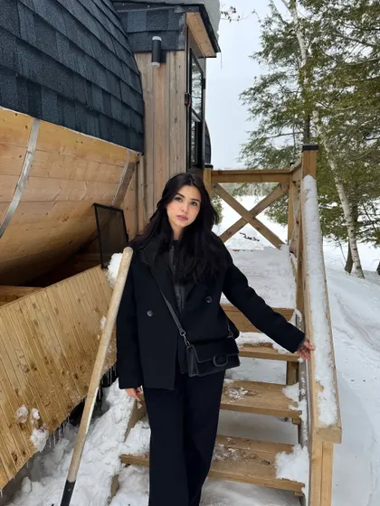 Posing on the snowy steps of the unique barrel stay in Parry Sound.