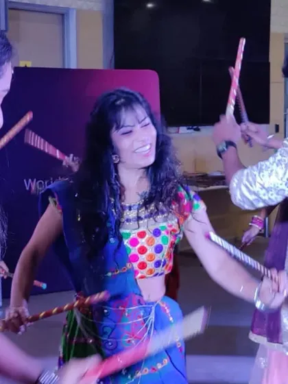 Teaching and dancing with participants during a corporate Dandiya event. I love sharing the joy of this festive dance.