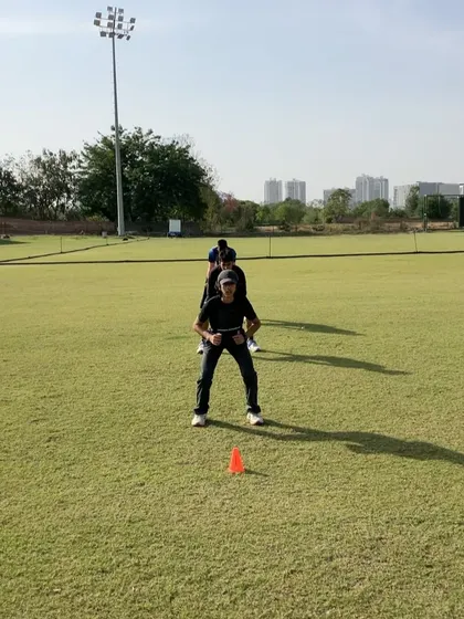 An athlete getting ready for a sled sprint. This drill is excellent for building acceleration power by adding resistance, forcing the body to produce more horizontal force with each step.