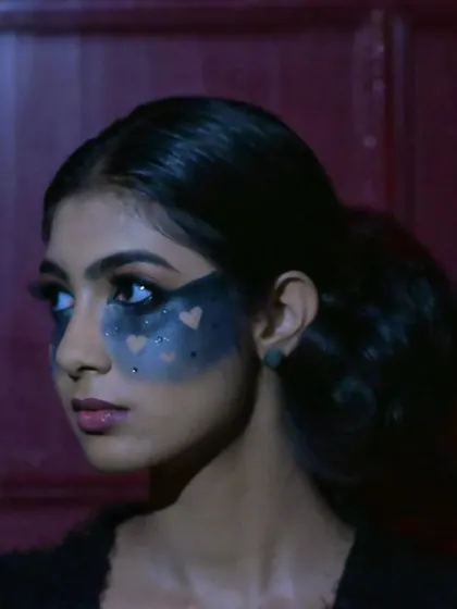 A side profile of the "Valentween" makeup, showing how the smoky heart effect is blended across the cheekbones.