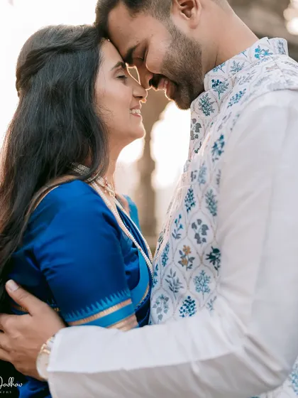 An intimate close-up filled with warmth and affection. The golden hour light enhances the romantic feel of this pre-wedding photograph.
