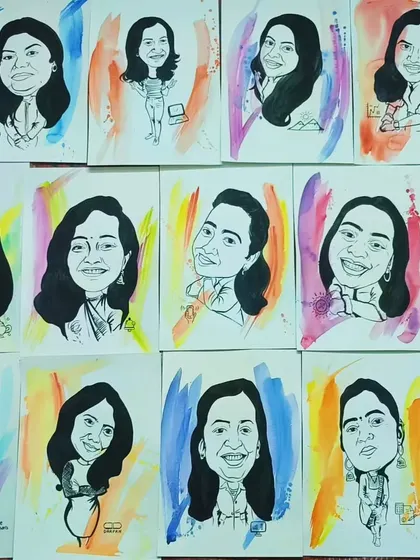 A flat lay of the many caricatures I created. Each one is unique, with a colorful watercolor background.