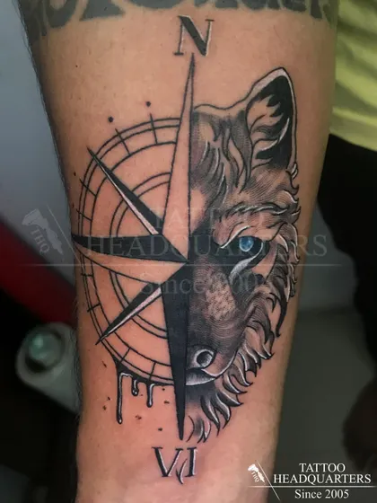 This wolf and compass piece is an example of our black and grey realism work. We focus on capturing sharp details and creating a design that has both meaning and impact.