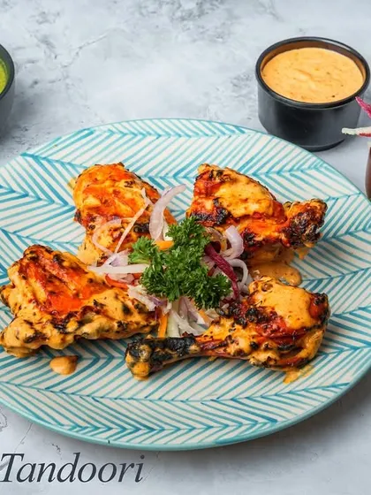 Sikanderi Tandoori offers a unique sweet and spicy flavor. The chicken is marinated in a special blend that gives it a distinct taste, setting it apart from the traditional tandoori preparation.