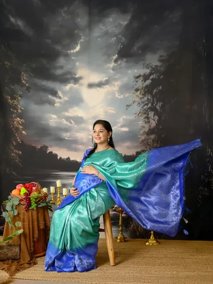 This series of portraits showcases the elegance of a maternity shoot in a saree. The flowing pallu and the rich colors of the silk create a stunning visual.