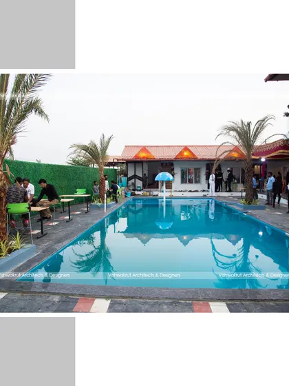 The pool and patio area of Rock Villa, designed for social gatherings. The layout provides ample space for seating and mingling, making it a functional and beautiful hub for the resort.