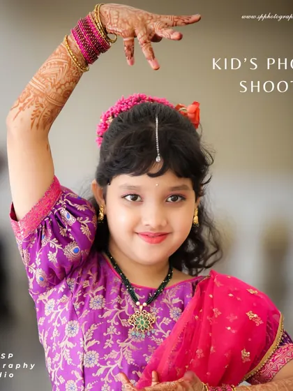This portrait of a young girl in a classical dance pose showcases her grace and the beauty of her traditional attire. We provide direction to capture elegant and expressive photos.