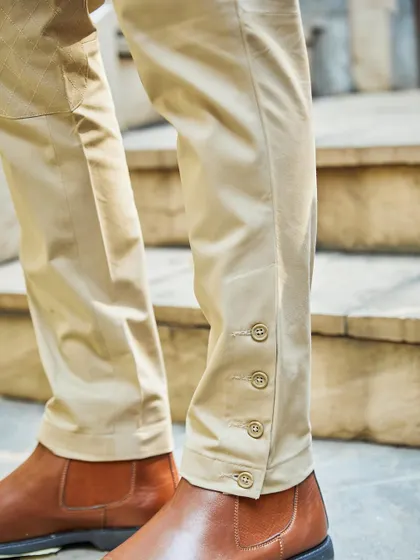 A close-up on the details of my breeches. The buttoned hem is a classic sartorial touch that adds a unique element to your trousers, perfect for pairing with Jodhpuri jackets.