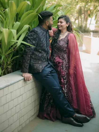 A relaxed and stylish portrait of an engaged couple, capturing their comfortable and loving interaction.