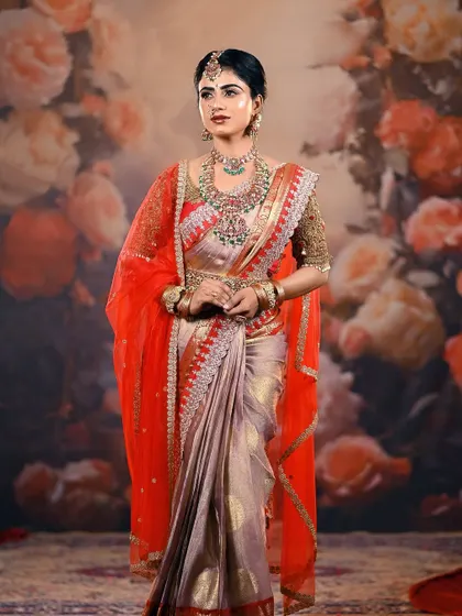 A full-length view of a stunning bridal look against a floral painted backdrop in my studio. The red veil adds a layer of drama and tradition to the ensemble.