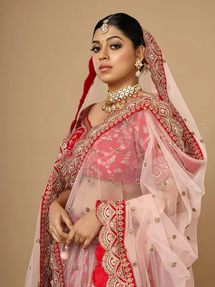 This shot shows how the kohl-defined eyes work with the entire bridal ensemble, including the delicate dupatta and statement jewelry.