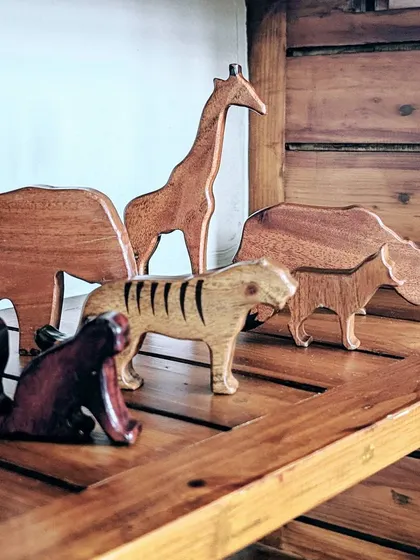 Our collection of wooden animals brings the study of zoology to life. Children can hold and examine the figures of a giraffe, tiger, and rhinoceros, learning their names and characteristics in a hands-on, engaging way.