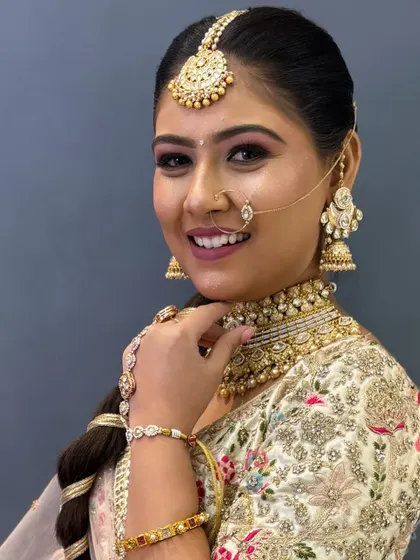 A close-up of Avani's makeup, highlighting her bright smile and beautiful eyes.