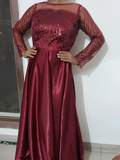 This burgundy star party wear gown is made from a premium, luxurious fabric. It's easy to wear and comes with a detachable can-can skirt to add as much volume as you like.