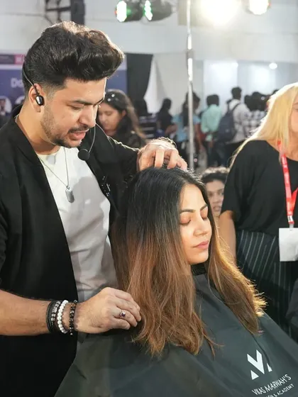 A shot of me working on a model's hair during a live stage event. These shows are all about sharing passion and creativity.