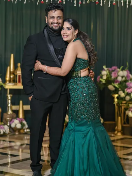 A warm and happy hug on the dance floor. This photo perfectly captures the celebratory and loving atmosphere of their cocktail night.