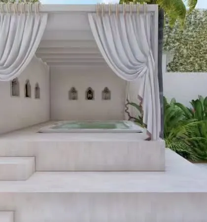This backyard design features a hot whirlpool tub that can fit up to six people. Surrounded by tropical plants and a cozy cabana, it's the perfect spot to soak and relax, especially on a cool Bangalore evening.