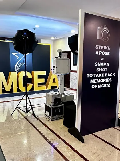 The complete photo booth station at the MCEA awards. The setup includes the booth, printer, and professional lighting, all in a compact footprint.