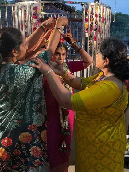 Family members come together to perform a traditional blessing during a wedding ceremony. These rituals are an important part of our family bonds and cultural heritage.