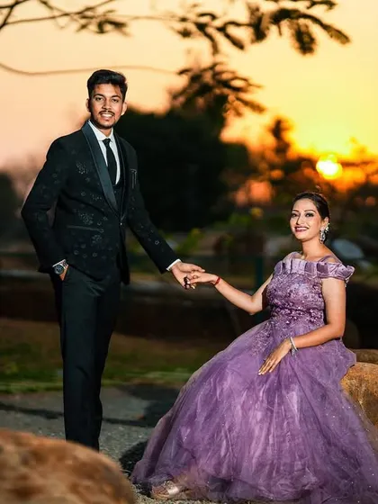 A beautiful sunset portrait of a couple, with the golden light creating a warm and romantic atmosphere.