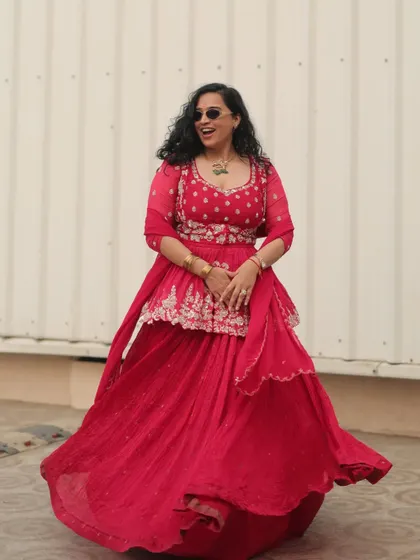 A full-length shot of my vibrant red outfit for a Mayra ceremony. This traditional event calls for a look that is both festive and elegant.