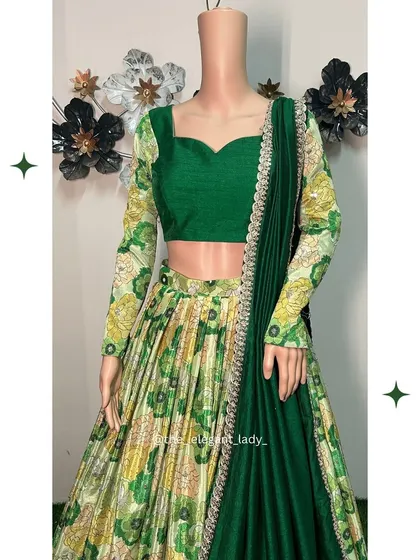 This green floral printed lehenga is a fresh and vibrant choice for a Mehendi or daytime event. The full-sleeved blouse and pleated skirt offer a unique and stylish silhouette.