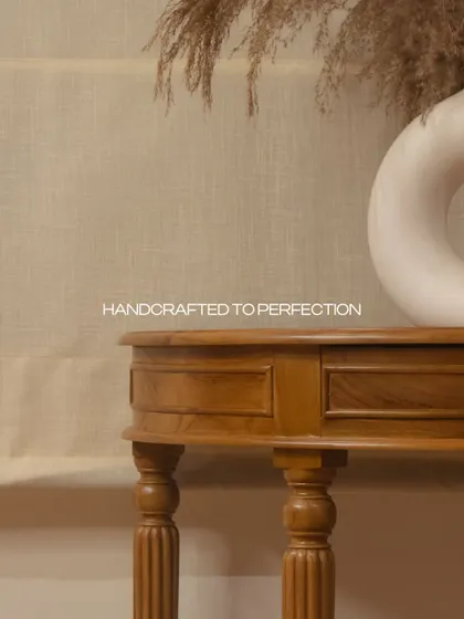 A detail of the console table, handcrafted to perfection. The turned legs and rich teak wood add a touch of sophistication and timeless beauty.