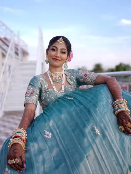 A full-length view of this stunning and unique reception lehenga. The makeup provides the perfect balance.