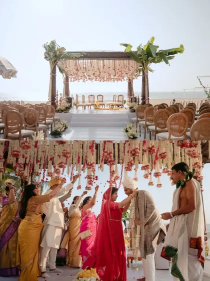 The final moments of the pheras, with family showering the couple with blessings and petals. This Goa beach wedding mandap, adorned with banana leaves and tuberose, was a beautiful blend of South Indian tradition and coastal charm.
