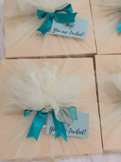 Another view of the elegantly wrapped event invitations, showing consistency in our bulk packaging.