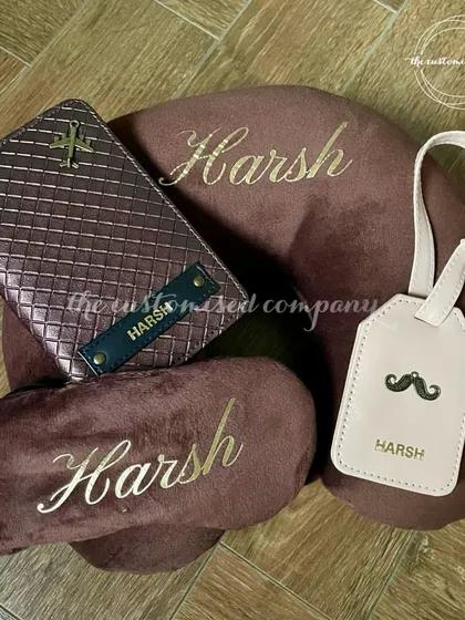 A perfectly coordinated travel set for him, featuring a rich brown color scheme. This set includes a personalized neck pillow, eye mask, passport cover, and luggage tag for stylish and comfortable journeys.