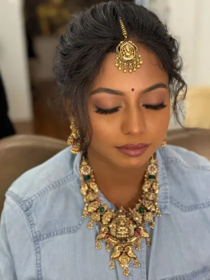 A unique shot of the bride-to-be in a casual shirt, but fully adorned with her engagement jewellery, showing how we try things out during the getting-ready process.