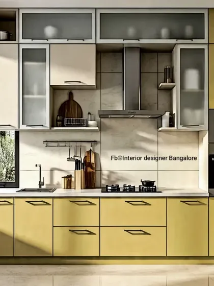 This L-shaped kitchen uses a cheerful yellow and off-white color scheme. The layout includes integrated appliances and a mix of drawers and cabinets for versatile storage.