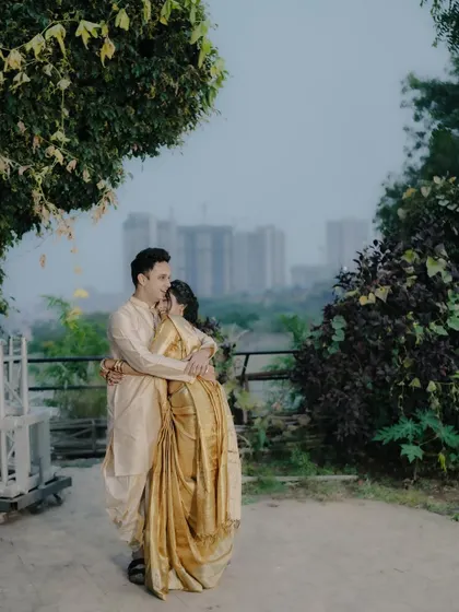 A loving embrace with the city in the background, symbolizing the start of their new life together.