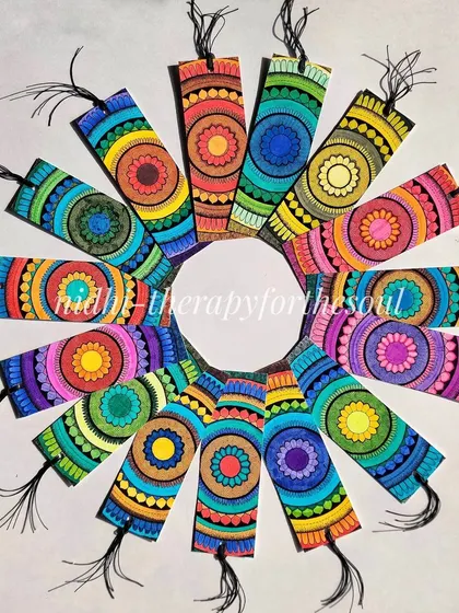 A collection of my handmade mandala bookmarks arranged in a colorful circle. These small pieces of art are perfect for book lovers and make great gifts.
